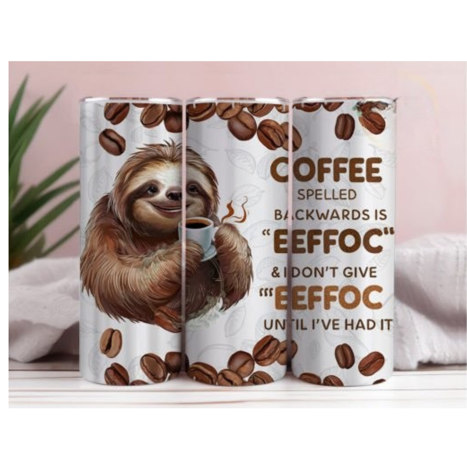 A white skinny tumbler with a brown sloth holding a coffee cup, surrounded by coffee beans, and text that reads 'COFFEE spelled backwards is ‘EEFFOC’ & I DON’T GIVE ‘EEFFOC’ UNTIL I’VE HAD IT'.